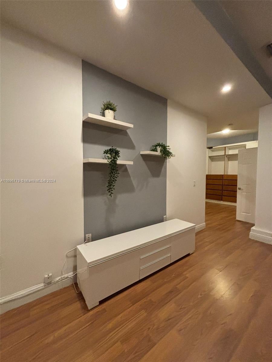 a view of livingroom and hardwood floor