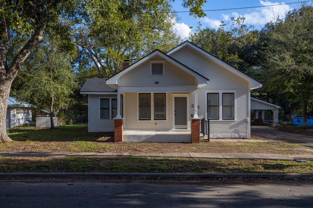 a house with trees in the background