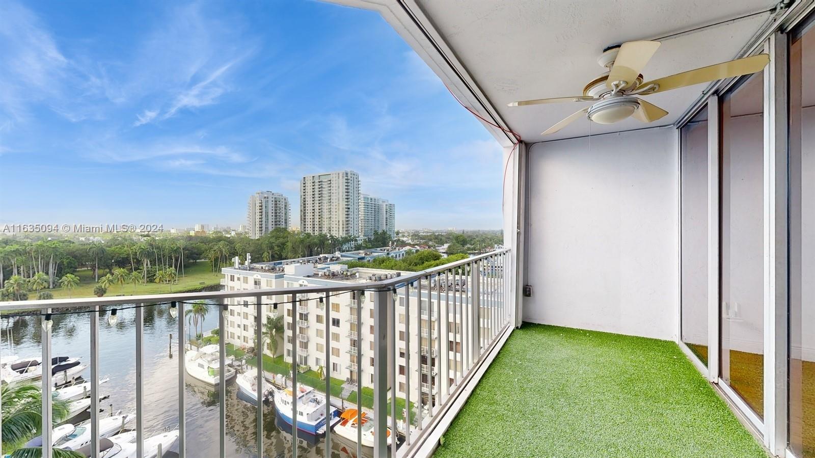 a view of a balcony with yard