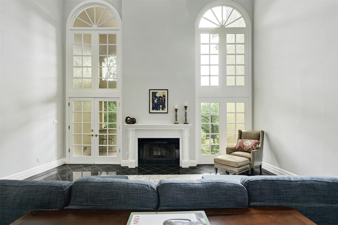 a living room with furniture windows and a fireplace