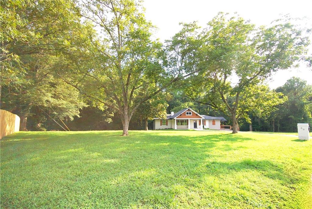 a house view with swimming pool in front of house