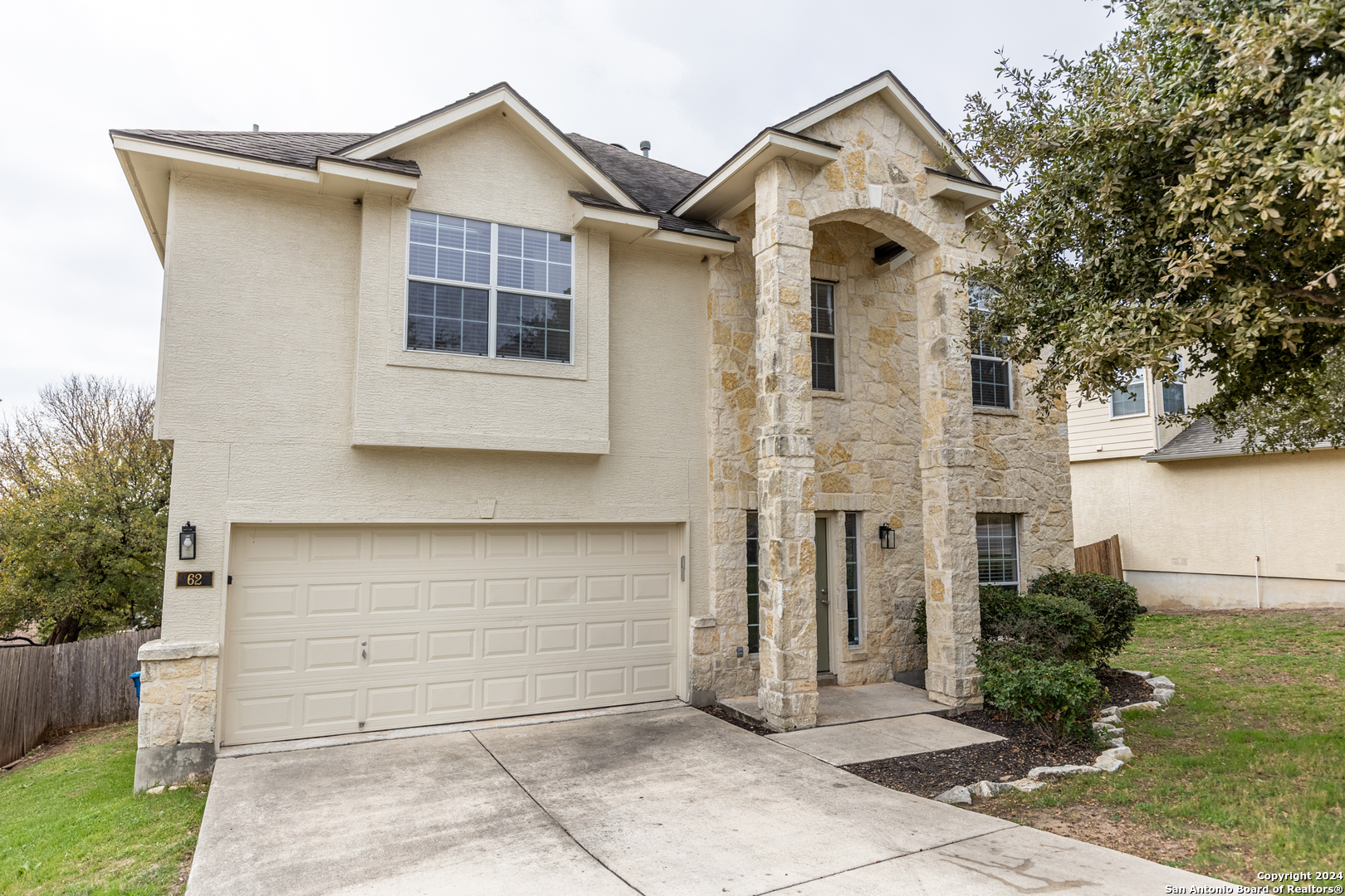 a front view of a house with a garage