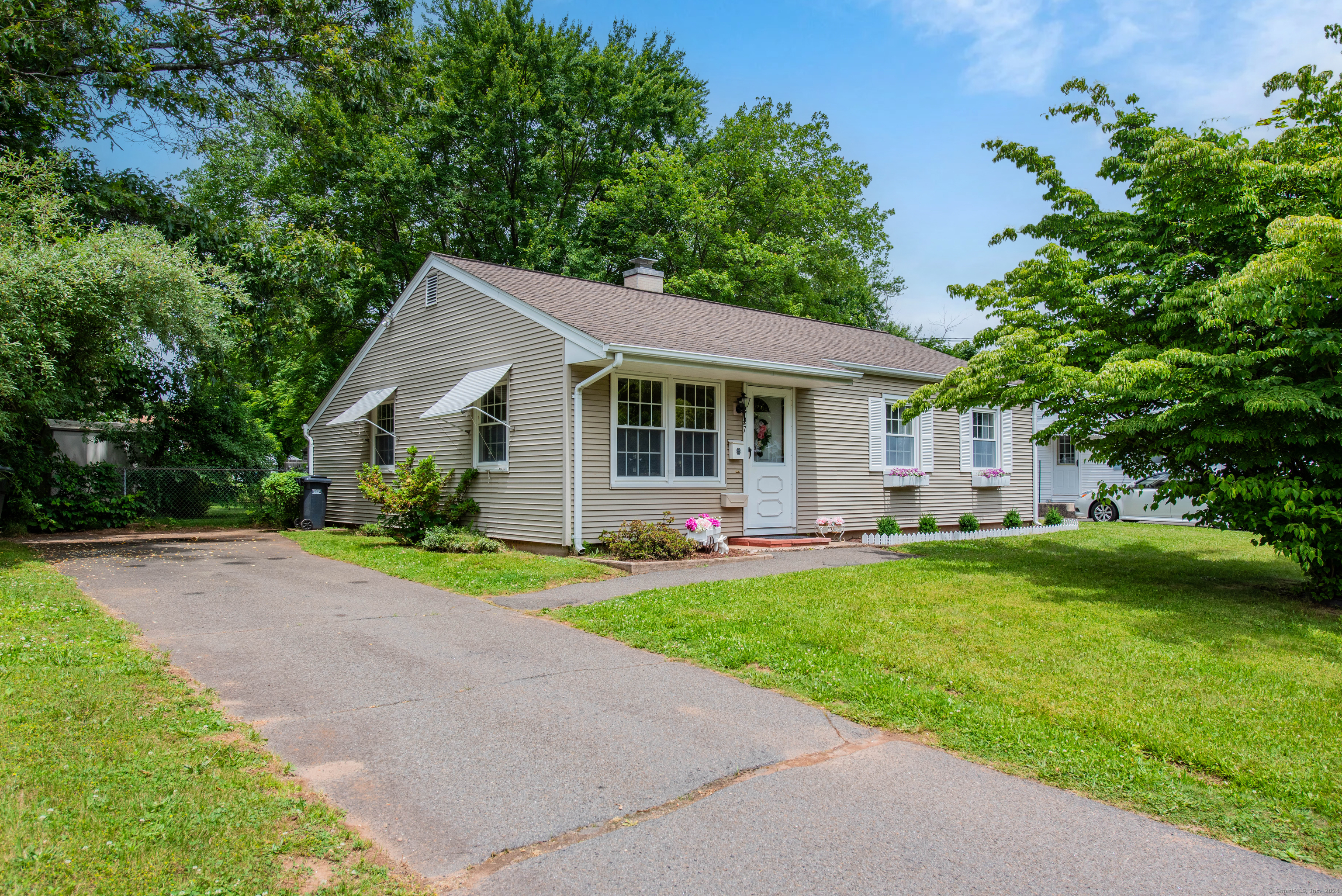 a front view of a house with a yard and porch