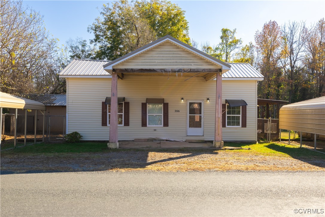 View of front of home with a carport