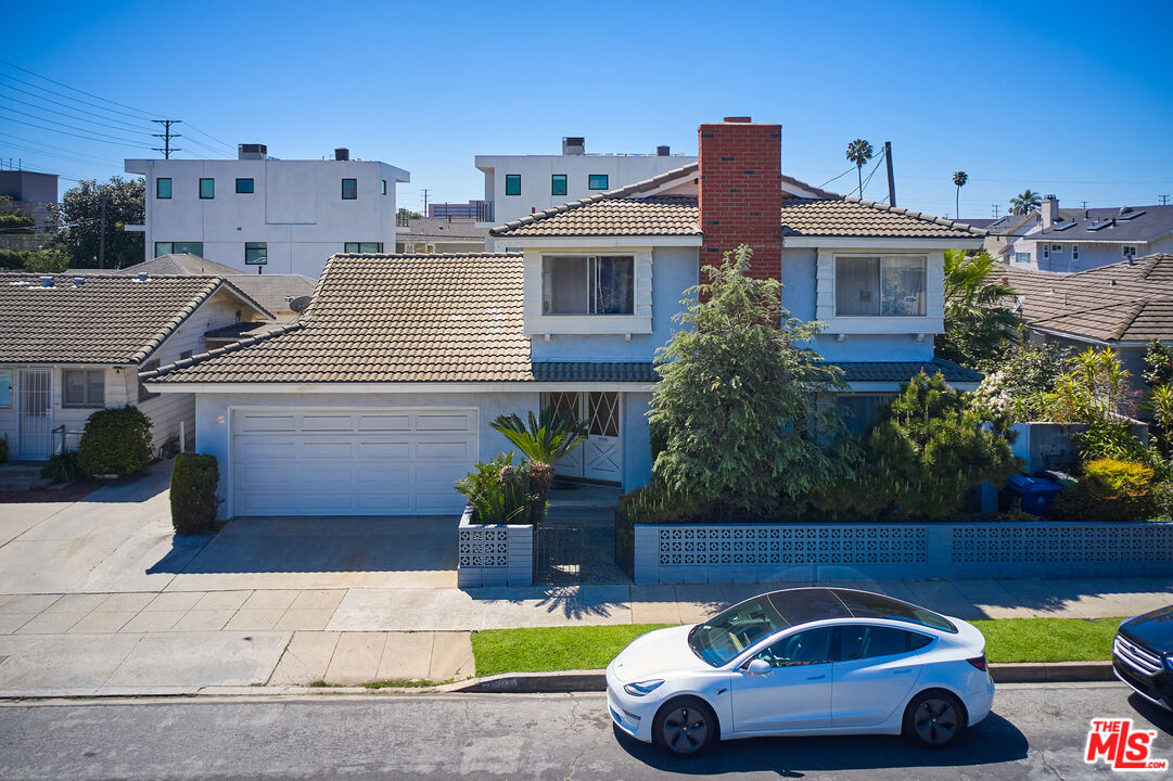 a front view of a house with parking space