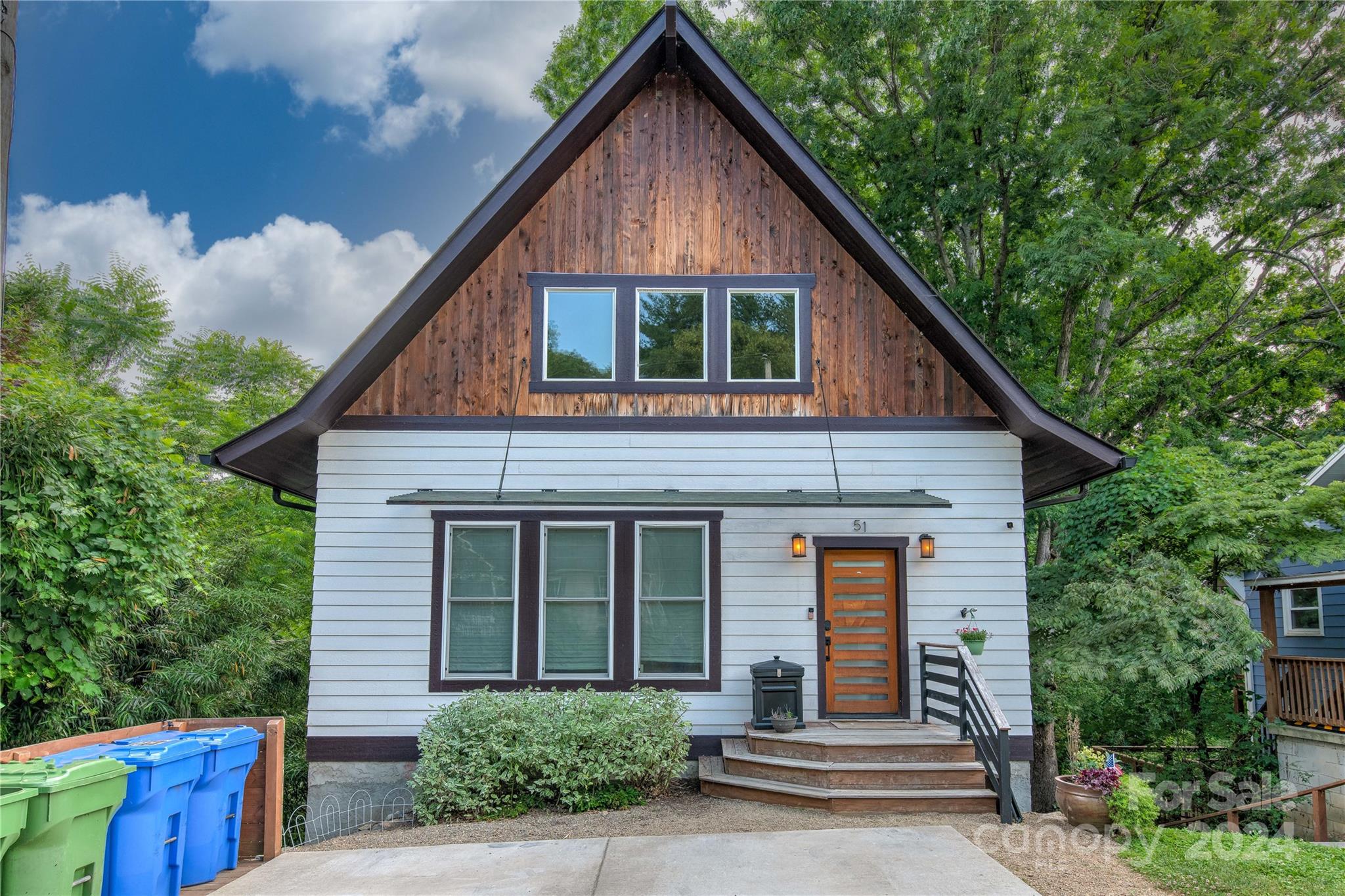 a front view of a house with garage