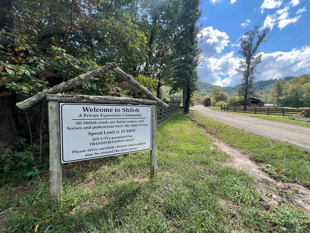 a view of a sign board and yard