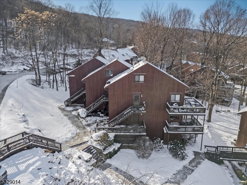 a aerial view of a house with a yard