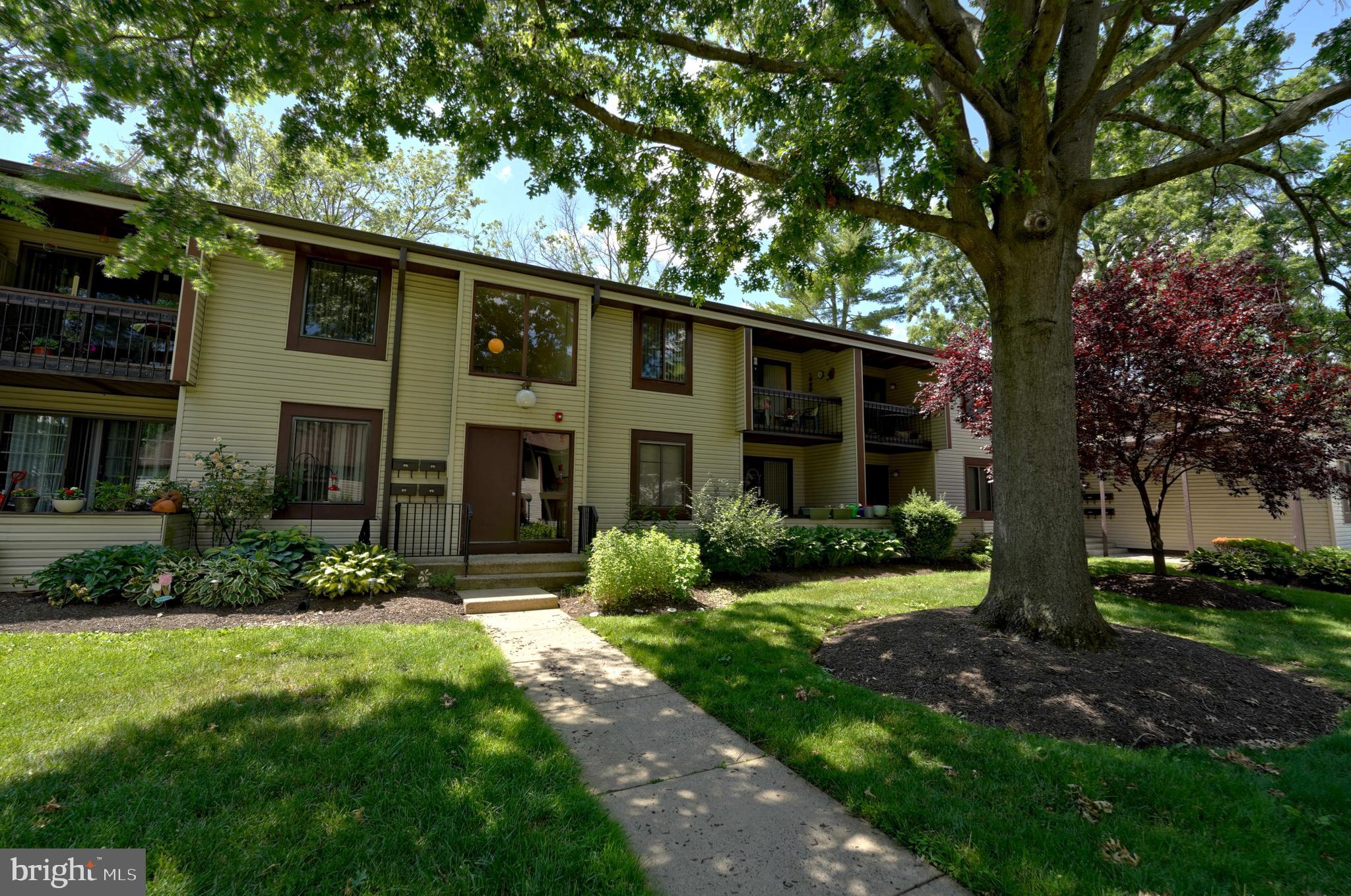 a front view of a house with a yard and porch