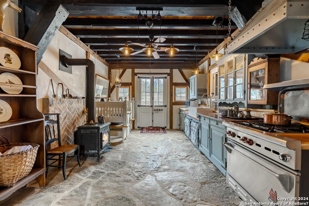 a kitchen with stove and cabinets