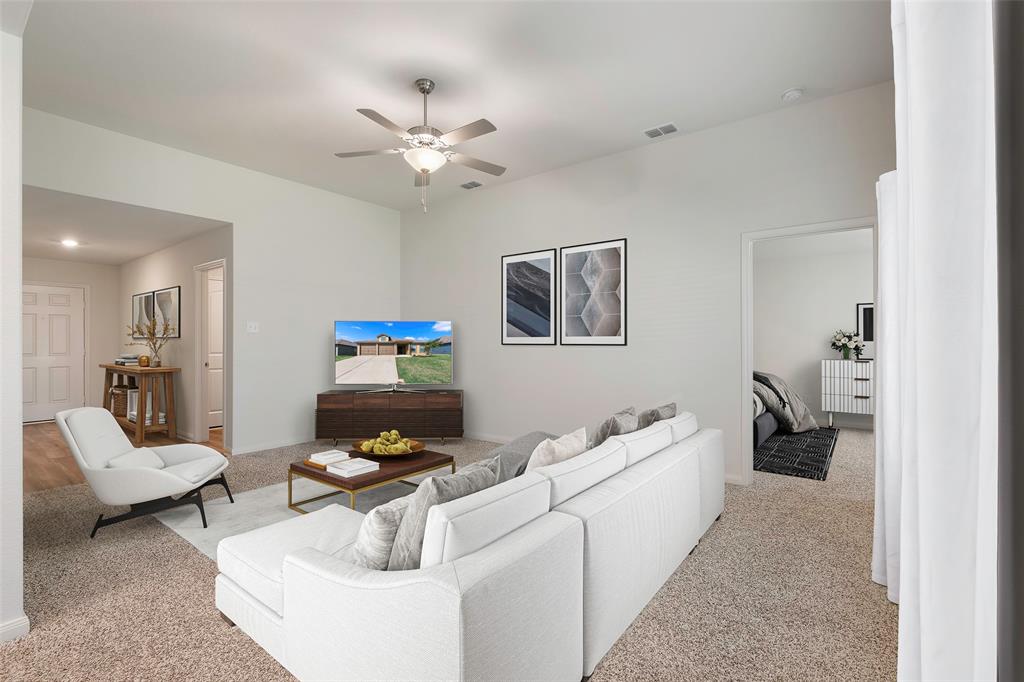 a living room with furniture and a chandelier