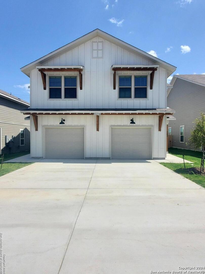 a front view of a house with garage