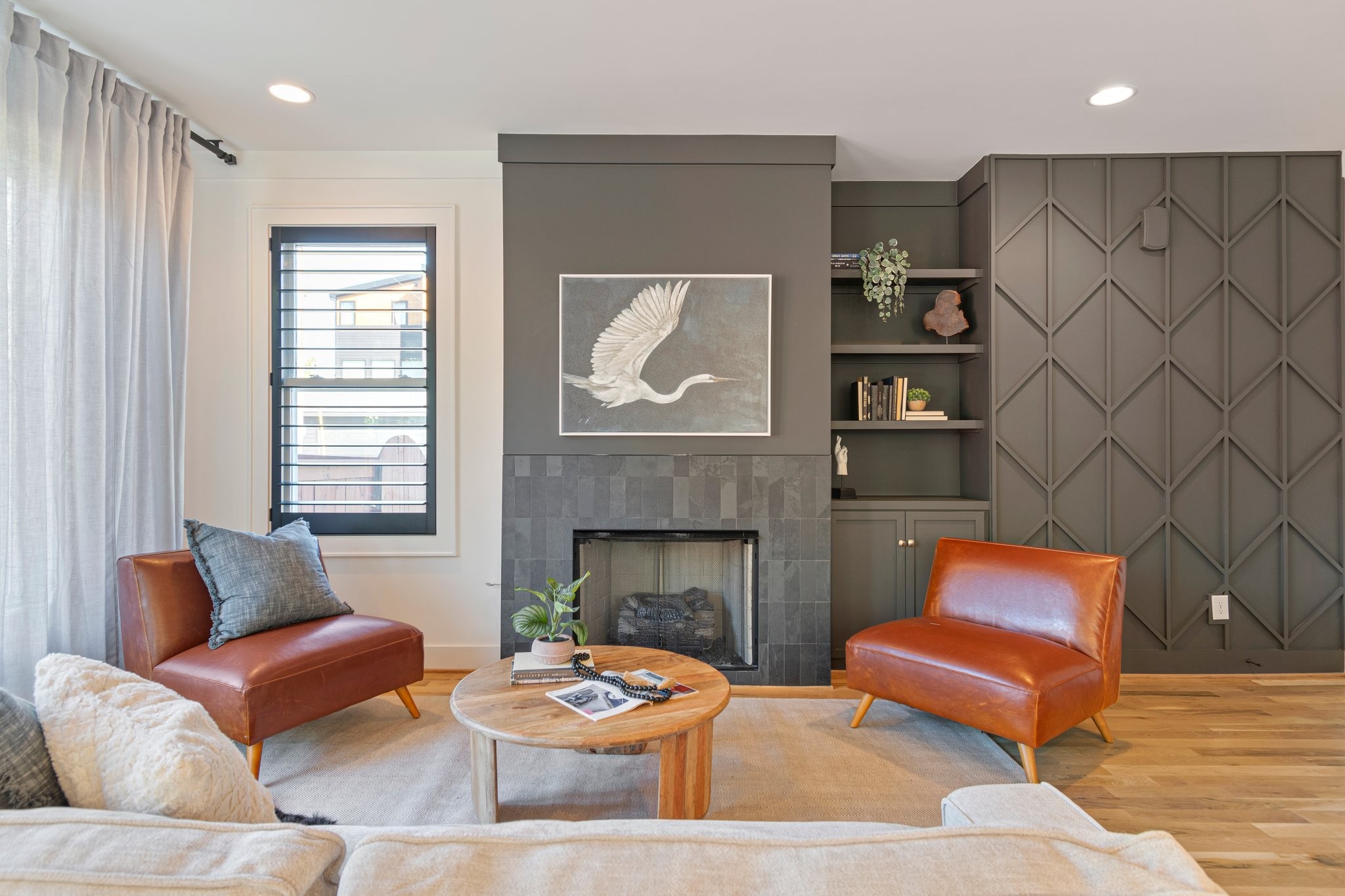 a living room with furniture and a fireplace