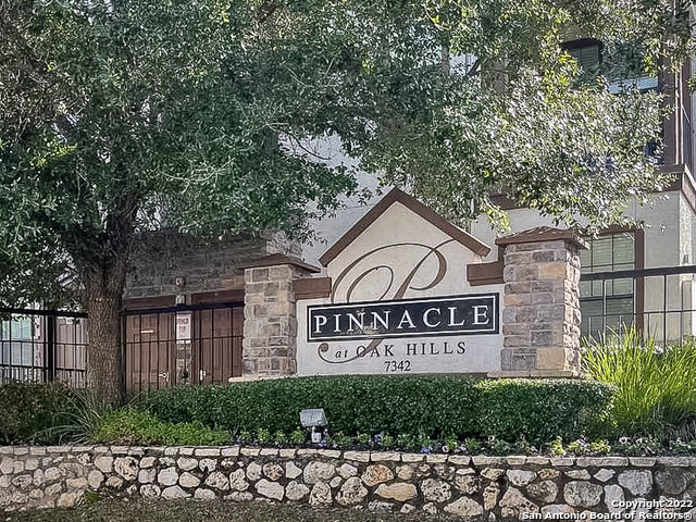 a view of sign board with a house