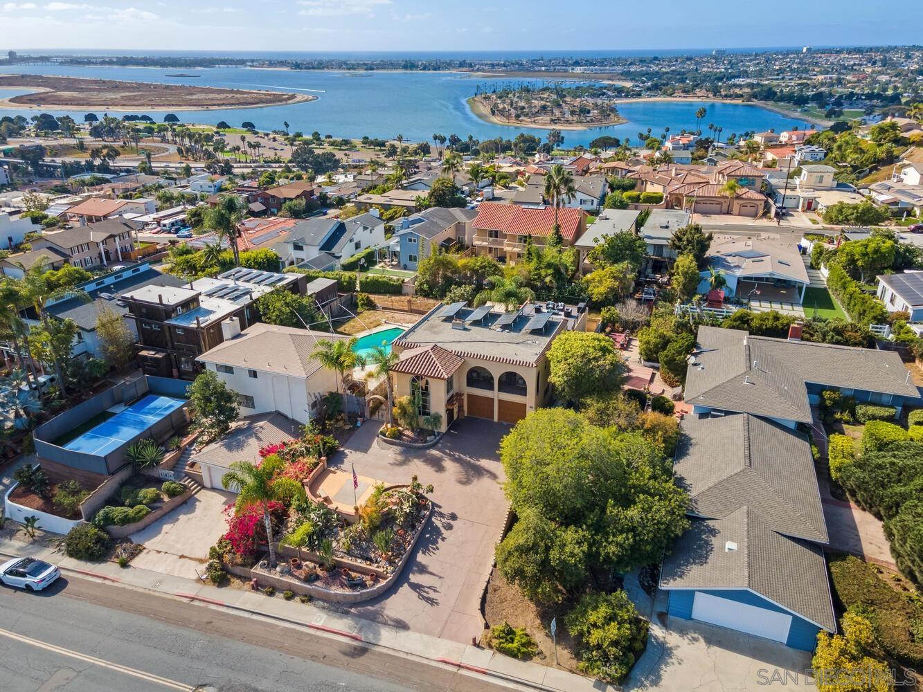 an aerial view of a houses with yard