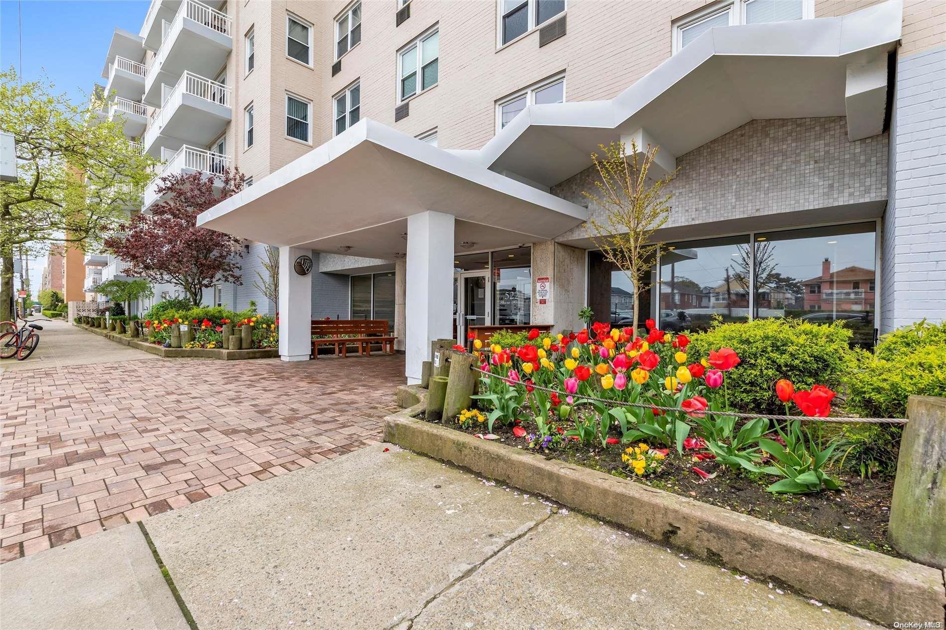 a view of building with flowers