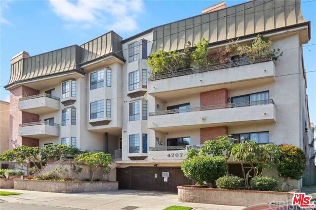 a front view of a multi story residential apartment building