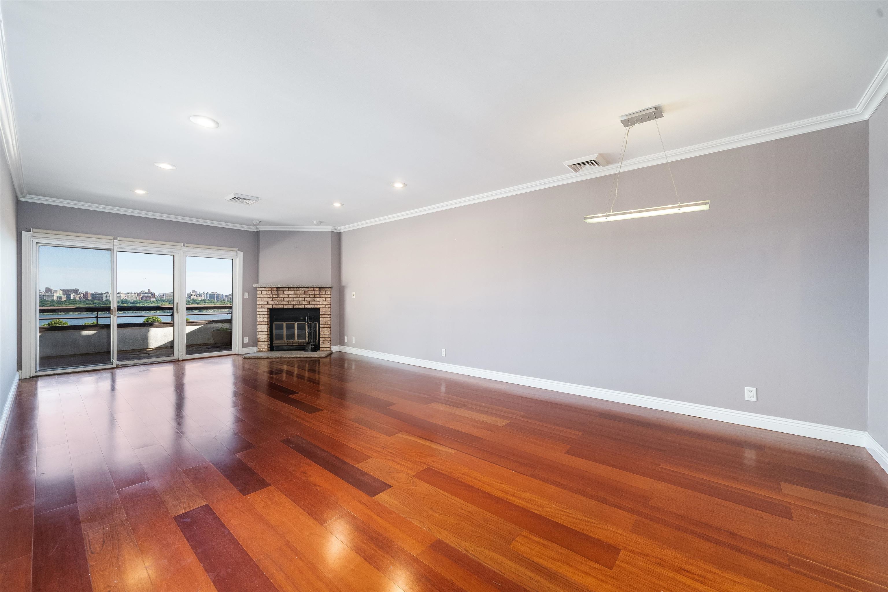 a view of a livingroom with wooden floor