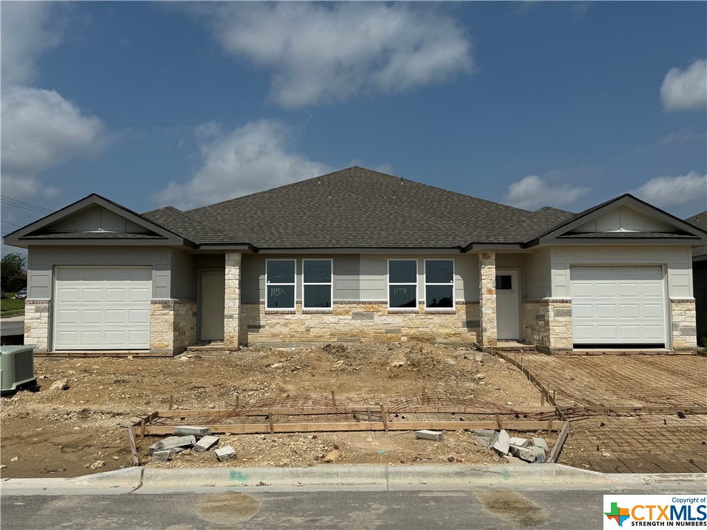 a front view of a house with yard