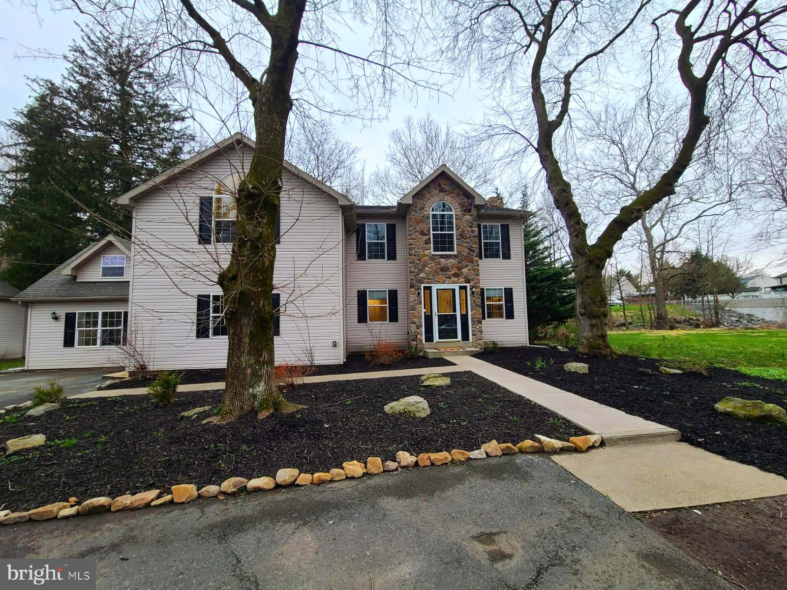 a front view of a house with a yard