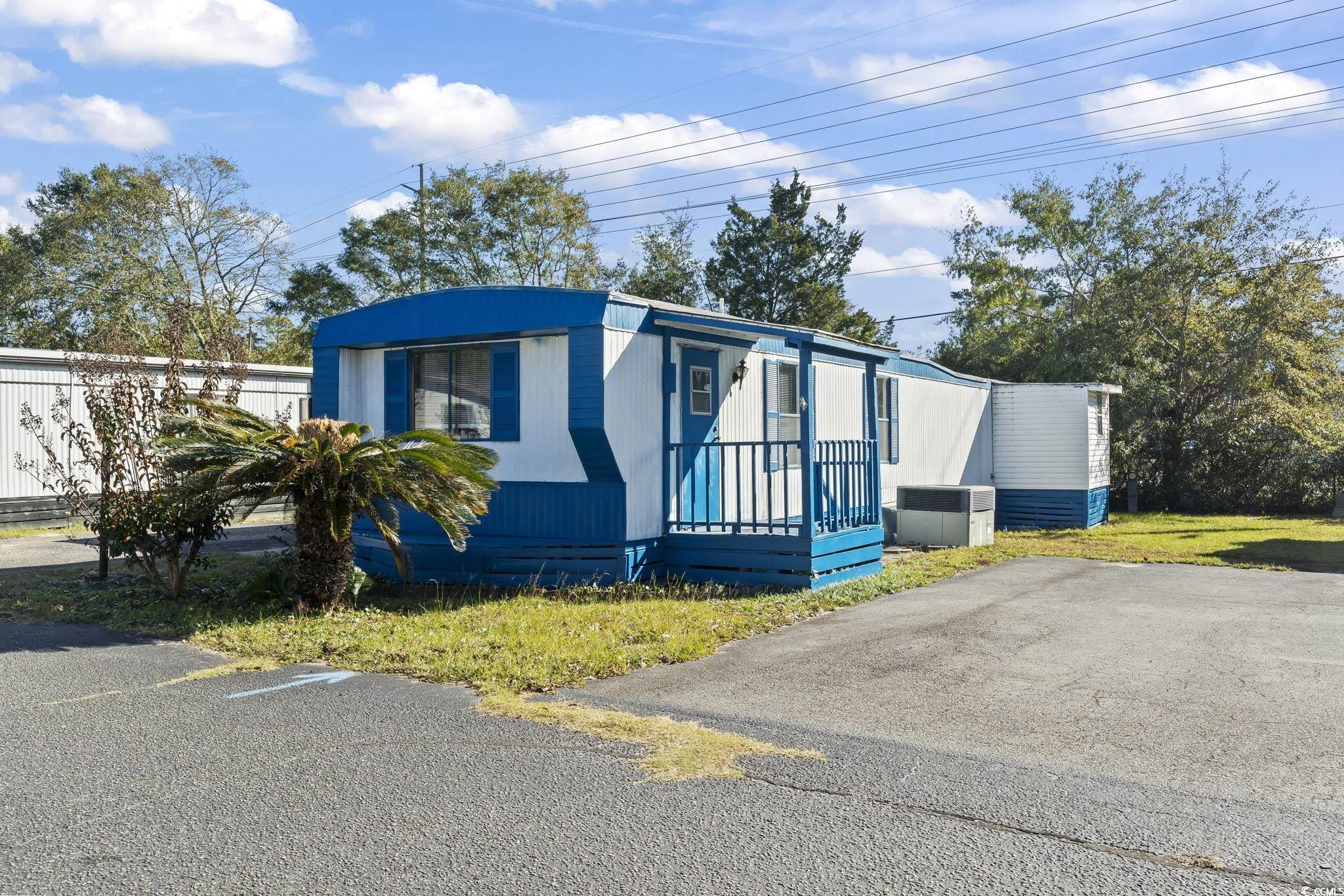 View of front of home with cooling unit