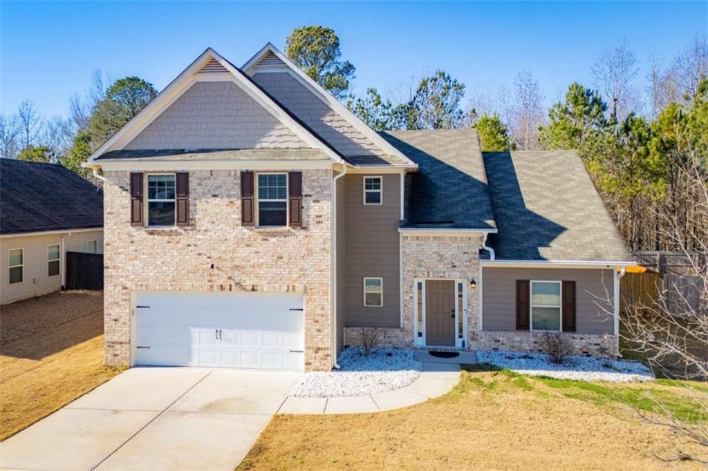 a front view of a house with a yard