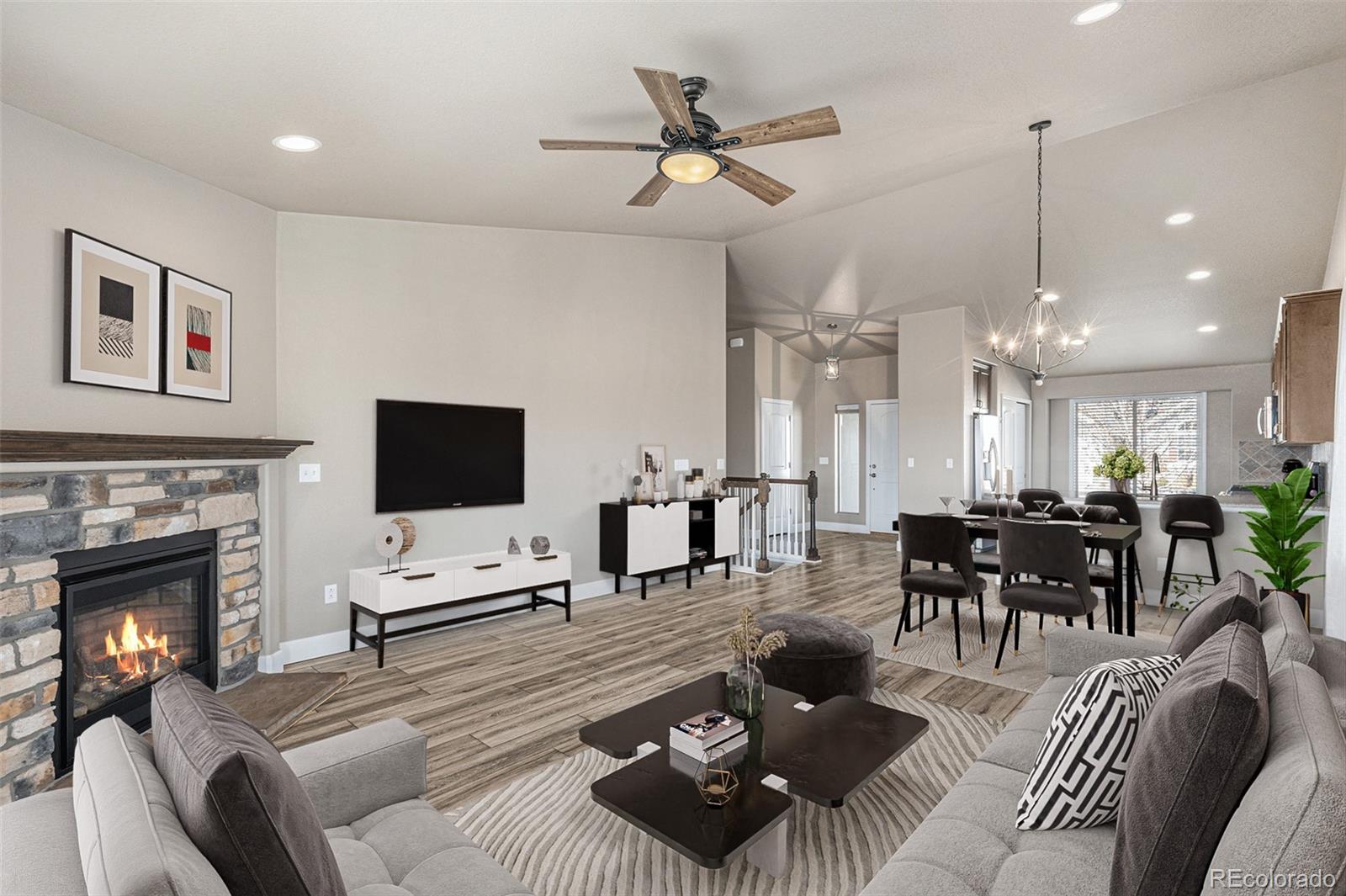 a living room with furniture a fireplace and a flat screen tv