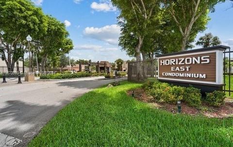 a view of a park with welcome board