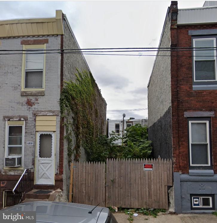 a view of a house with a street