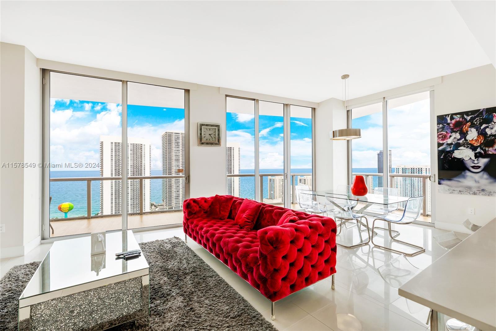 a living room with a large window and a couch