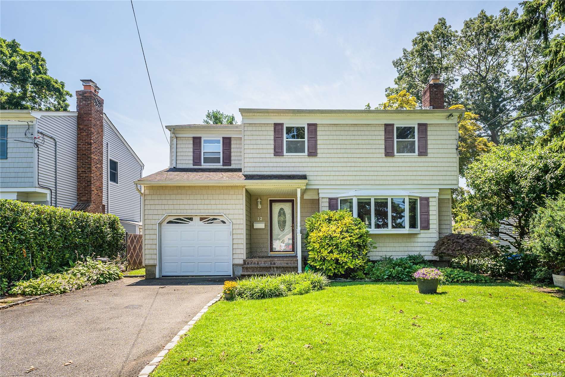 a front view of a house with yard