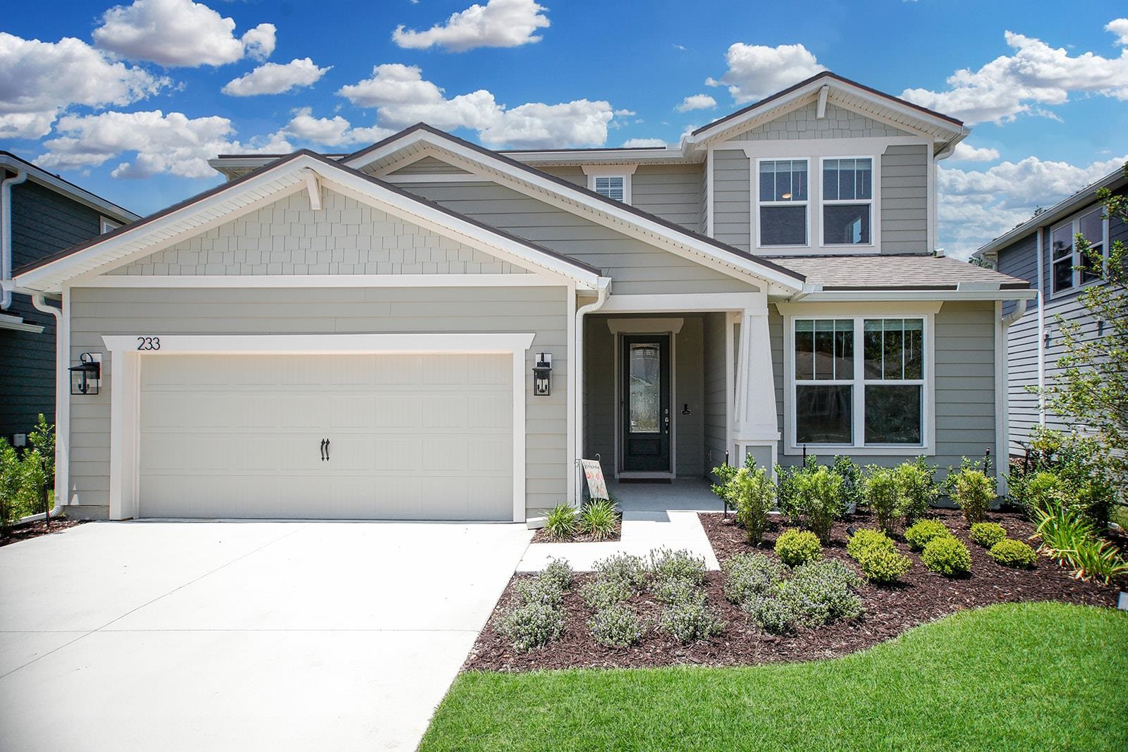 a front view of a house with a yard