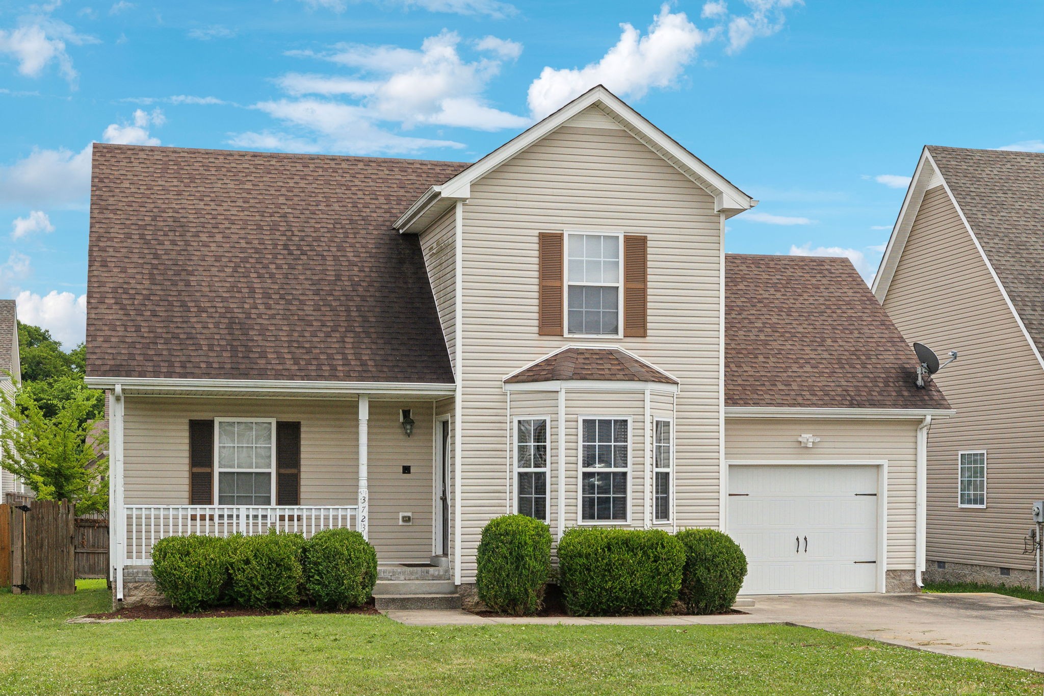 a front view of a house with a yard