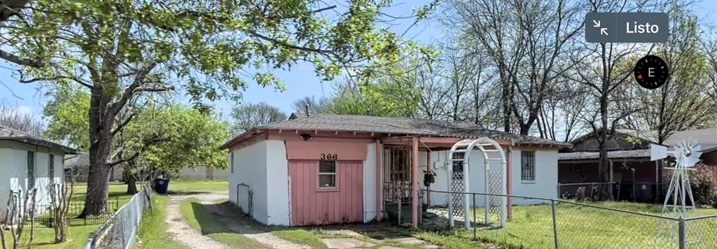 a view of a house with a iron gate