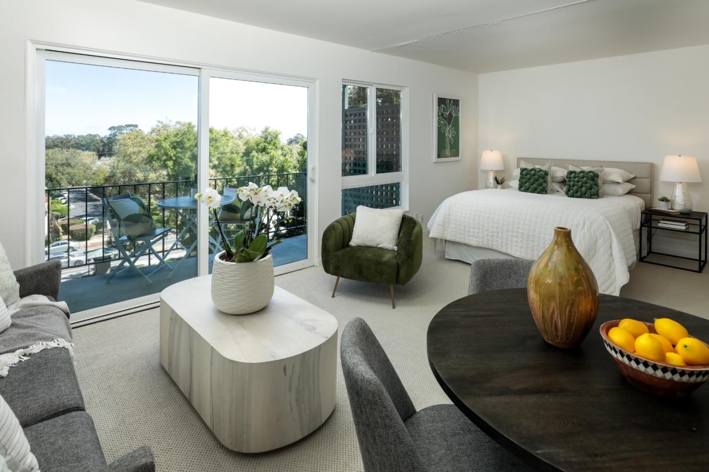 a bedroom with furniture and a potted plant