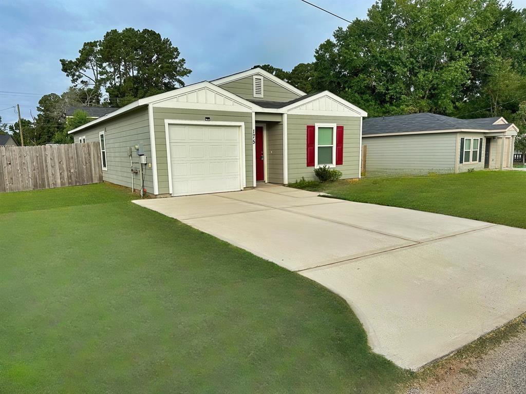 a front view of a house with yard