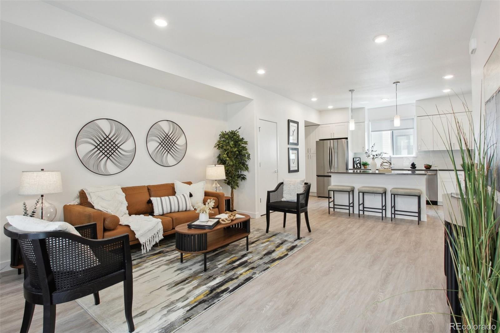 a living room with furniture and a clock