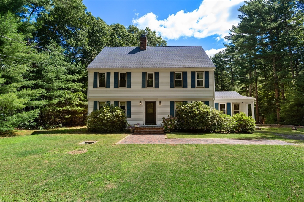 a aerial view of a house next to a yard