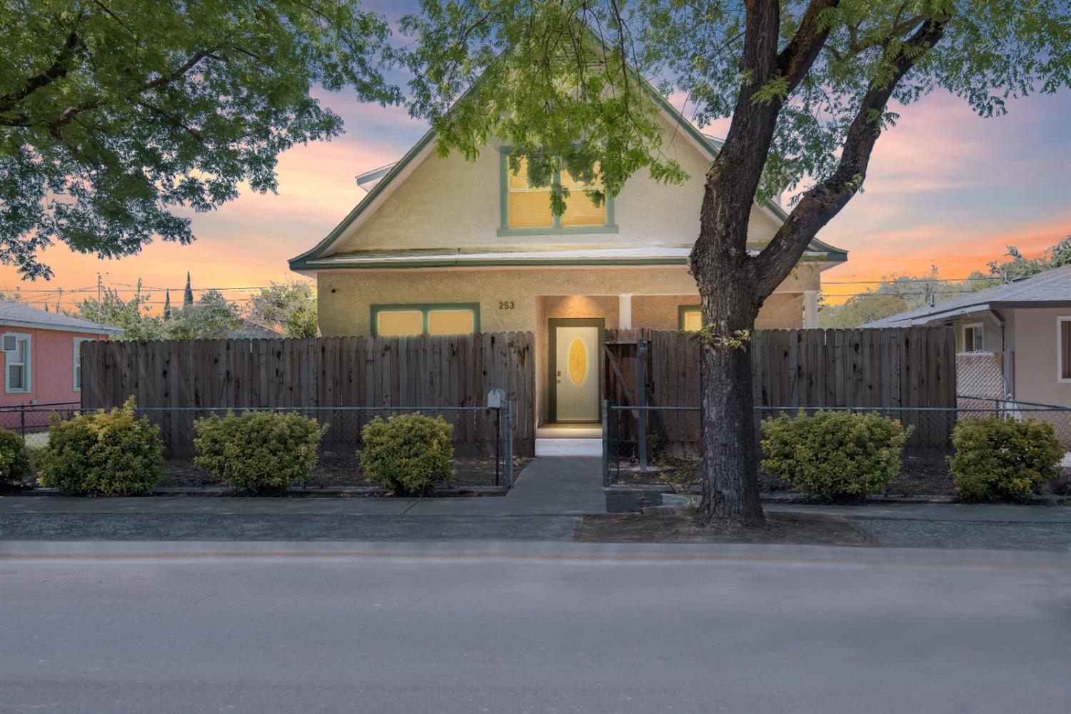 a front view of a house with garden