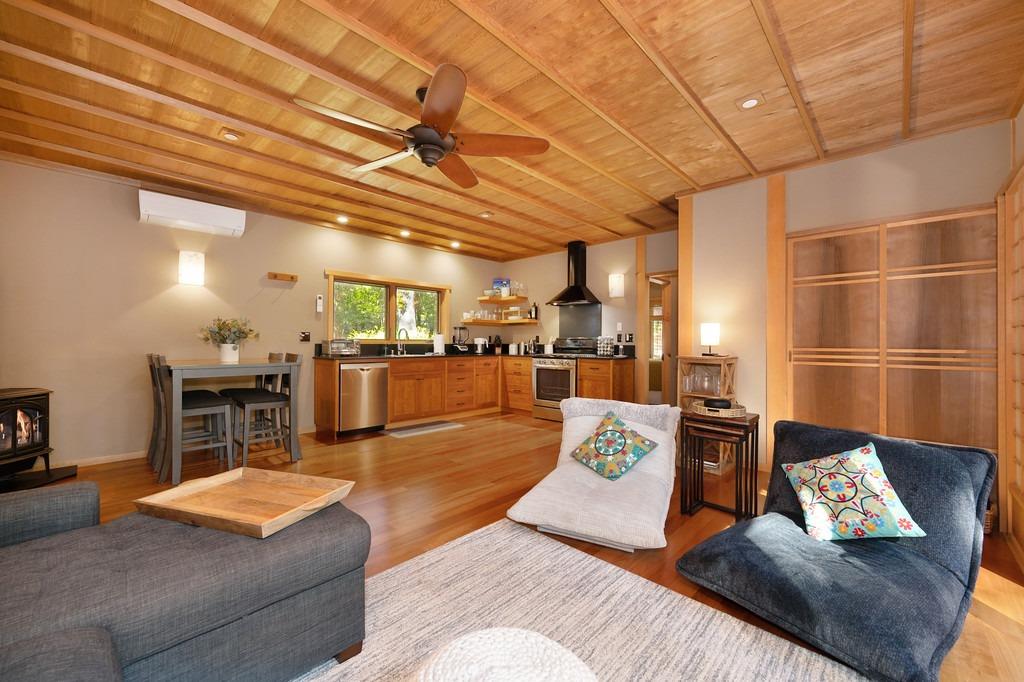 a living room with furniture and kitchen view