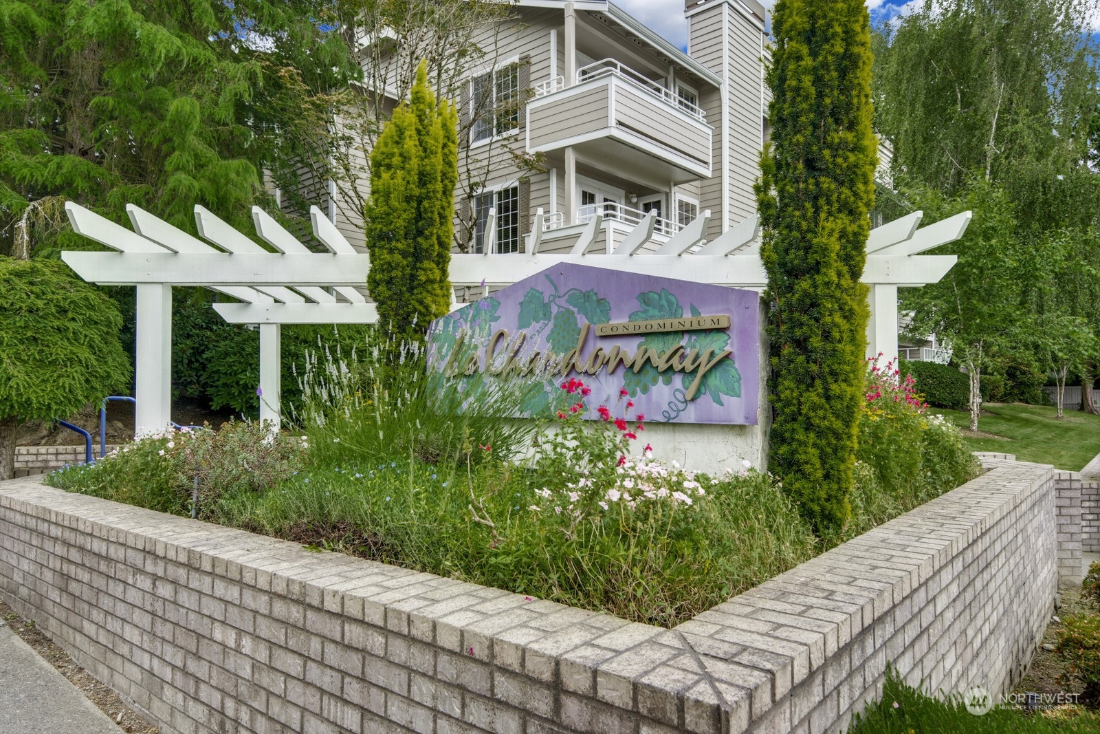 a view of a sign board with garden