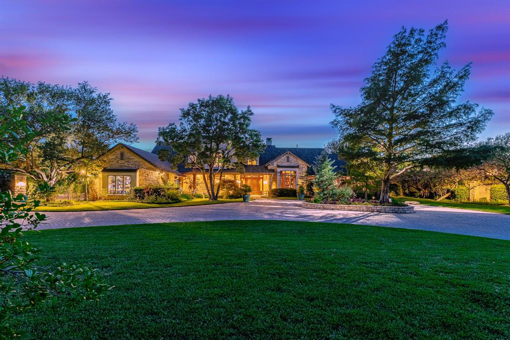 a front view of a house with a big yard