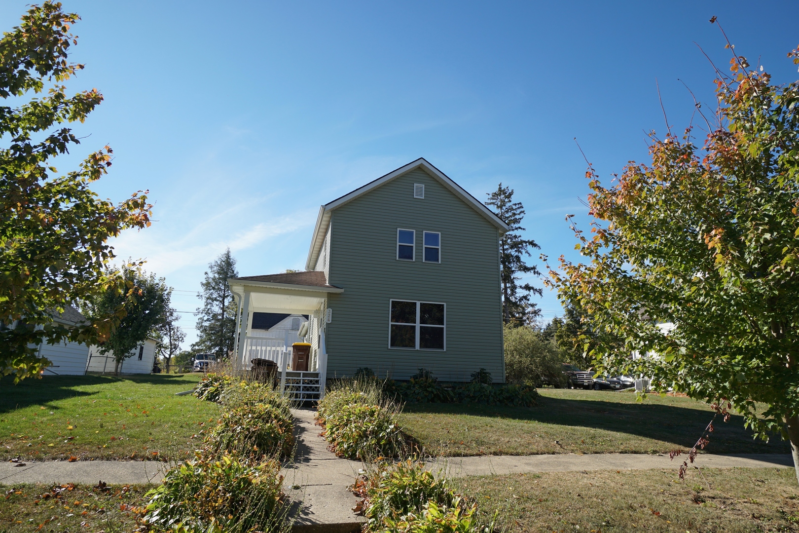 a front view of a house with garden