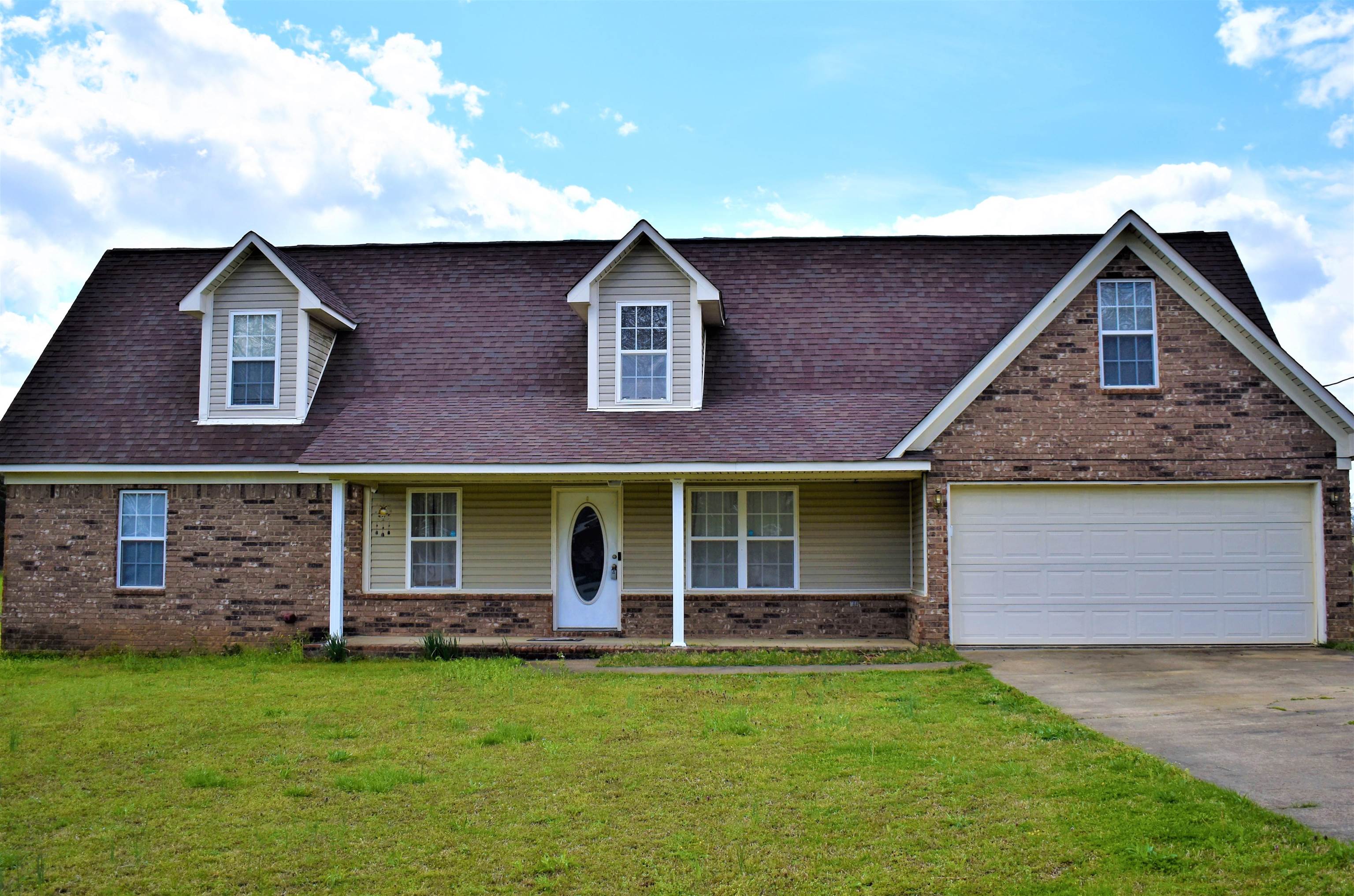 front view of a house with a yard