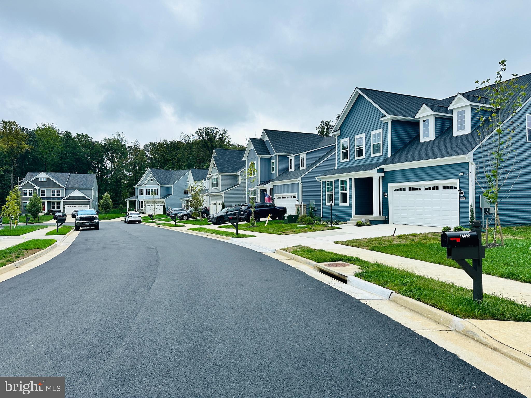 a view of multiple houses with a street