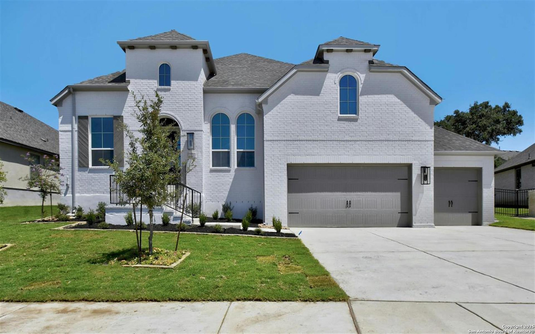 a front view of a house with a yard