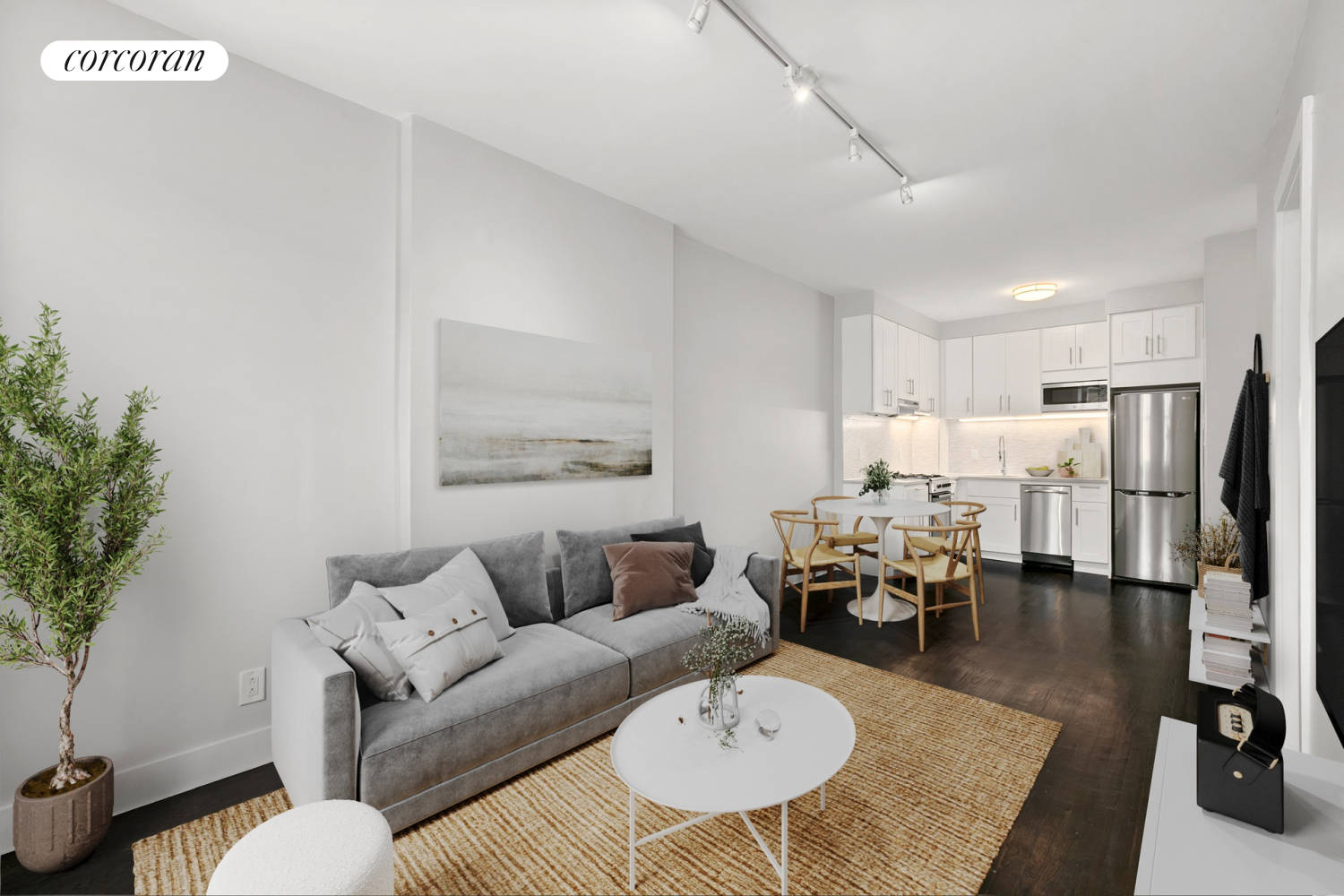 a living room with furniture kitchen view and a table