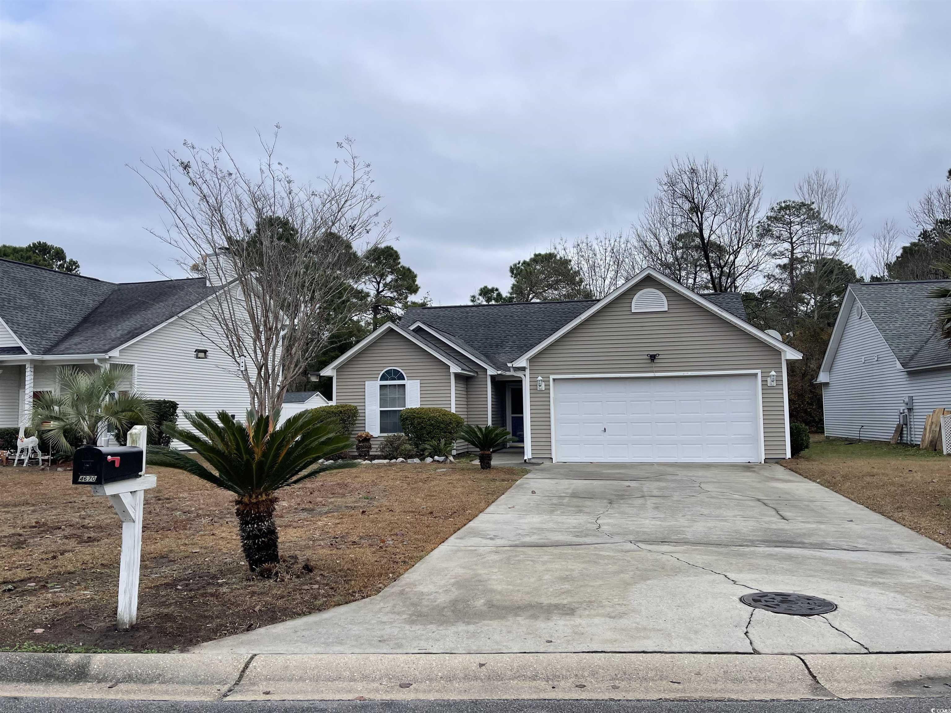 Ranch-style house featuring a garage