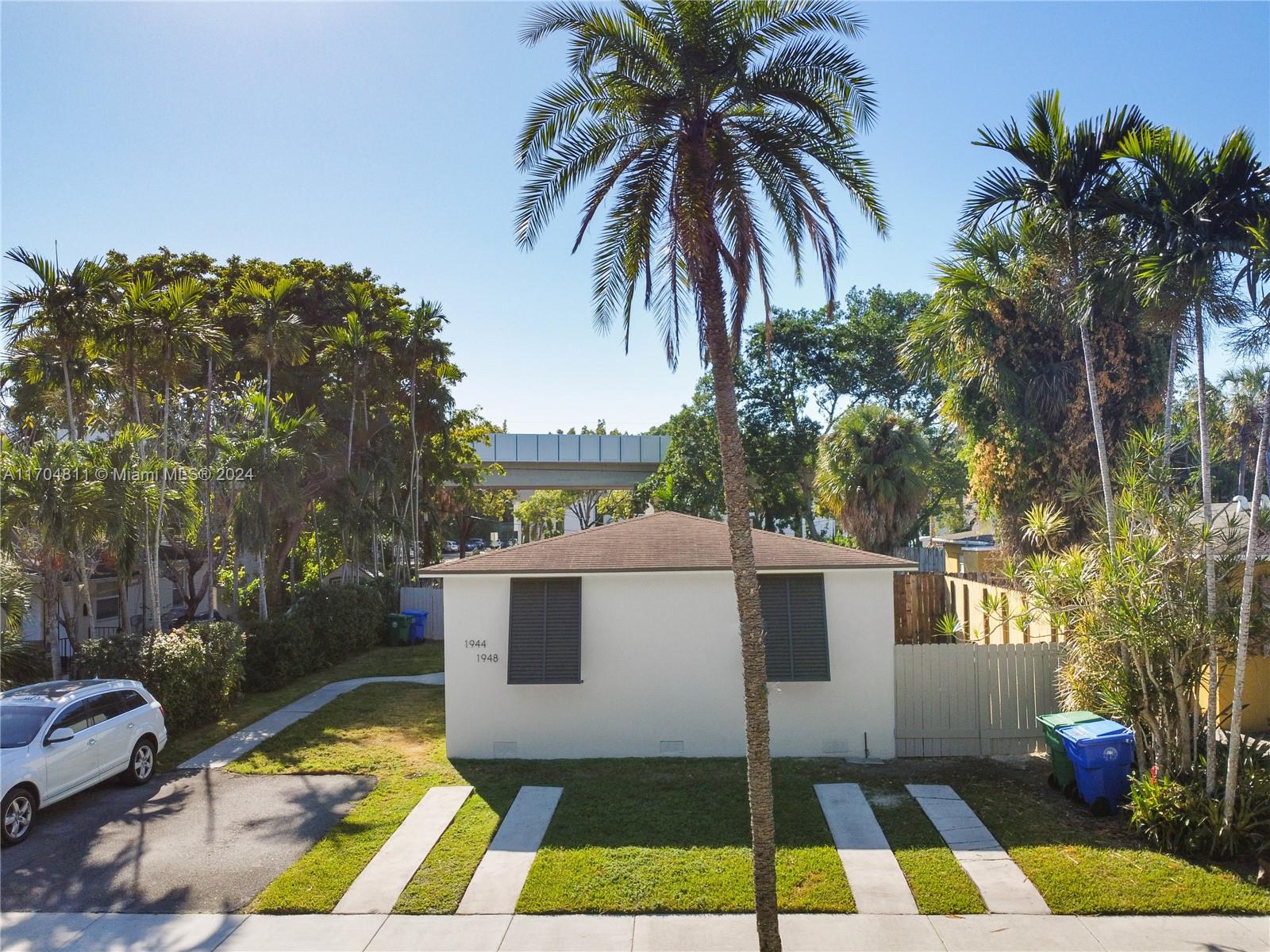 a view of a backyard with swimming pool