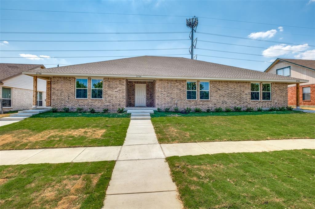 a front view of house with yard